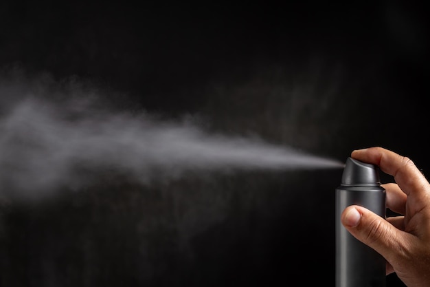 Photo deodorant spray on dark background