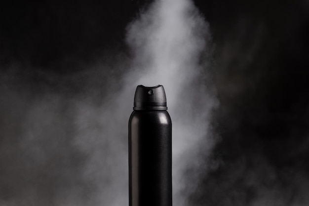 Photo deodorant spray on dark background