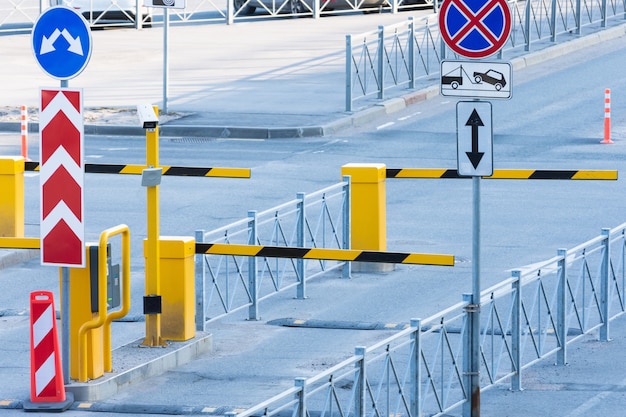 Photo departure check in with a barrier for vehicles with a fenced area.