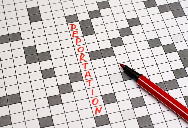 Photo deportation. text in crossword. red letters