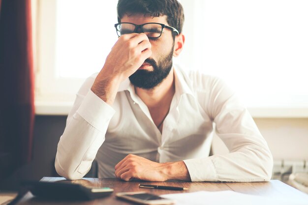 Depressed businessman in office