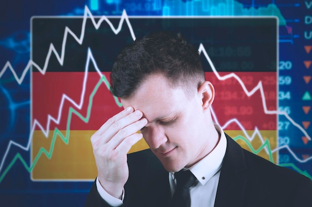 Photo depressed businessman with declining finance graph