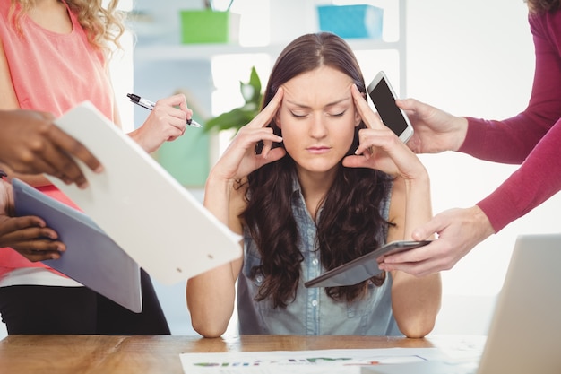 Depressed businesswoman with eyes closed 