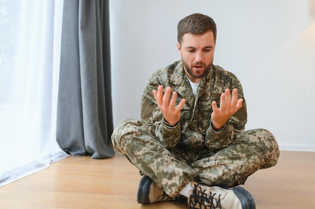 Depressed man recalling war days Portrait of veteran soldier who has PTSD