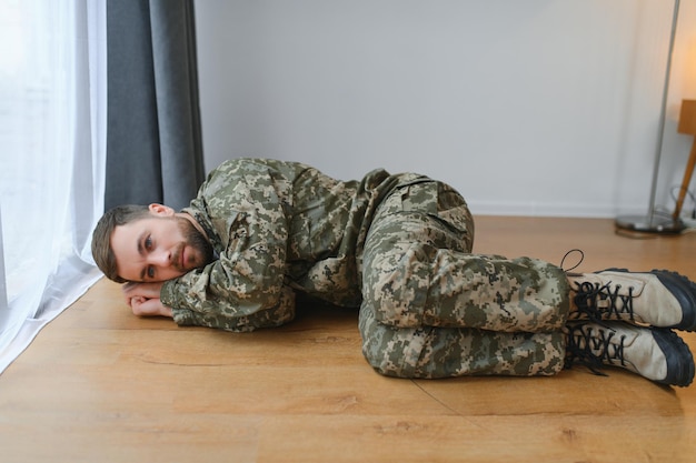 Depressed man recalling war days Portrait of veteran soldier who has PTSD