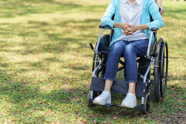 Depressed sad asian woman in wheelchair lonely disabled adult