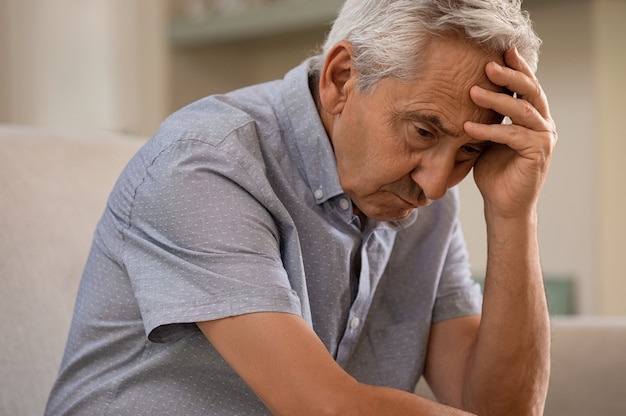 Depressed senior man at home