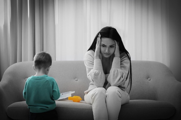 Depressed single mother with child at home color toned