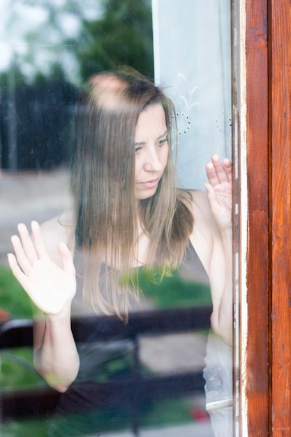 Depressed woman standing 