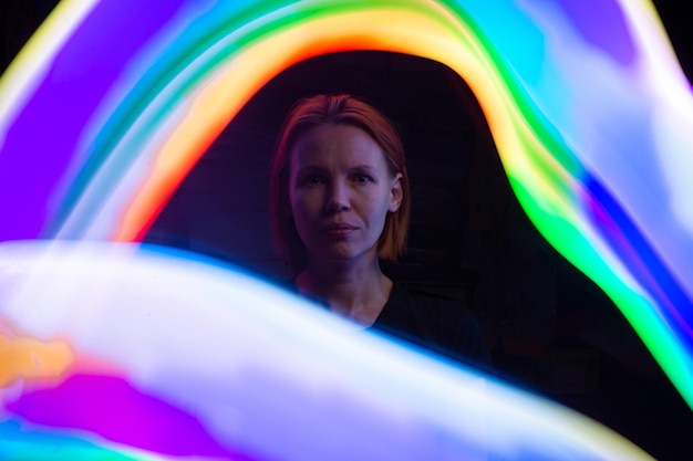 A depressed woman surrounded by colored waves