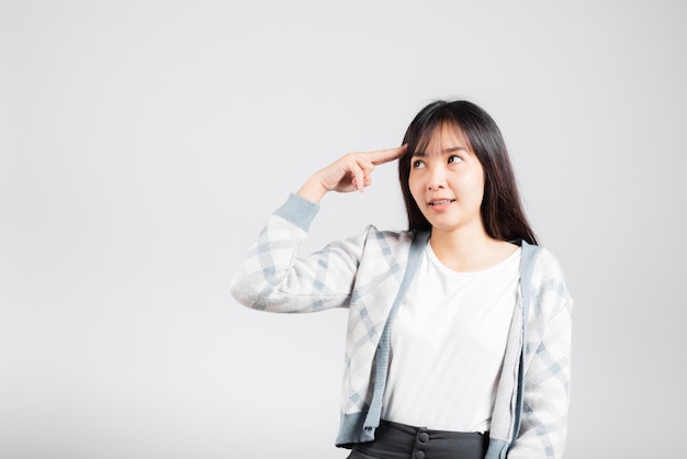 Depressed woman wanting shooting to kill herself by holding fingers on her head