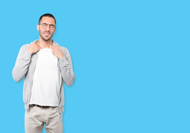 Depressed young man doing a gesture of stress