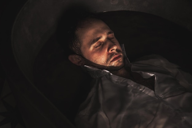 Depressed young man mental health in bathtub in bathroom at home