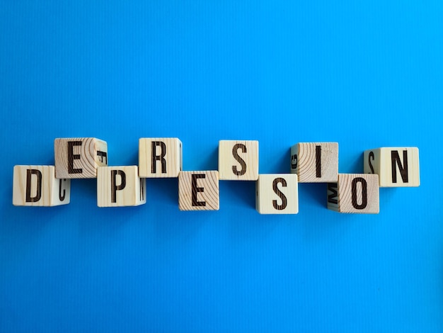 Depression written with wooden cubes on table