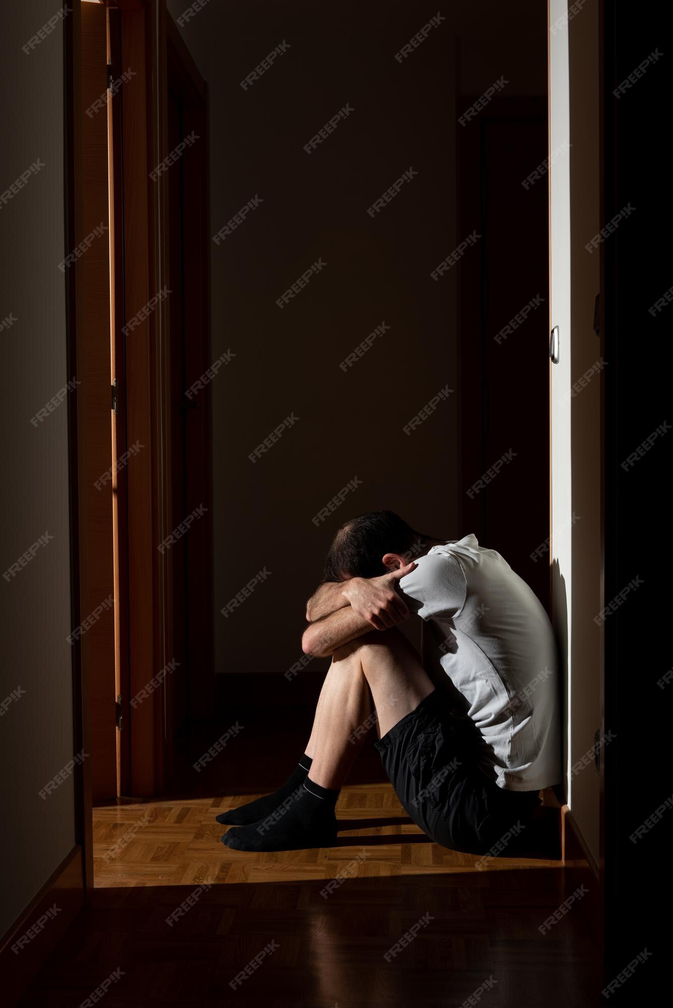 Dramatic, Silhouette of Sad Depressed man sitting head in hands on the  floor. Sad man, Cry, drama, lonely and unhappy concept. 5496246 Stock Photo  at Vecteezy