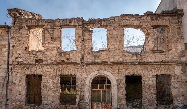 A derelict bomb damaged ruin from the war in Bosnia in the city of Mostar, Bosnia &amp; Herzegovina