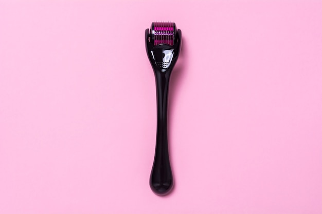 Photo derma roller on pink