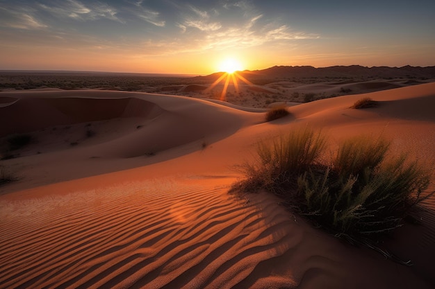 Desert dunes with view of a distant sunrise and the warm colors of dawn shining through