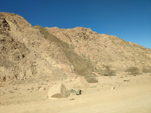 Desert land with mountains and sea