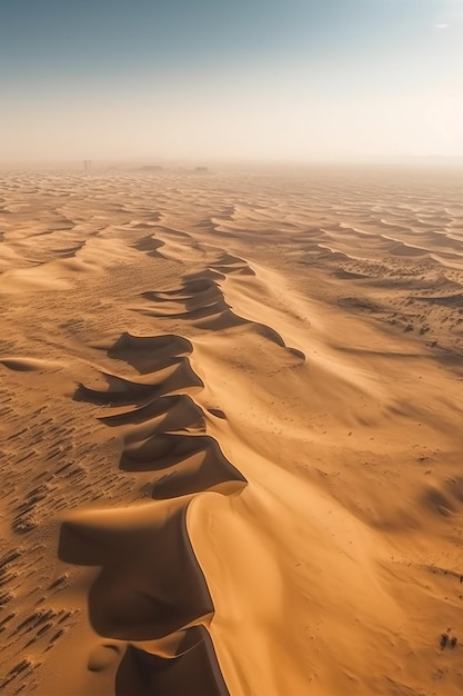 A desert landscape with sand dunes and a sunset in the distance.