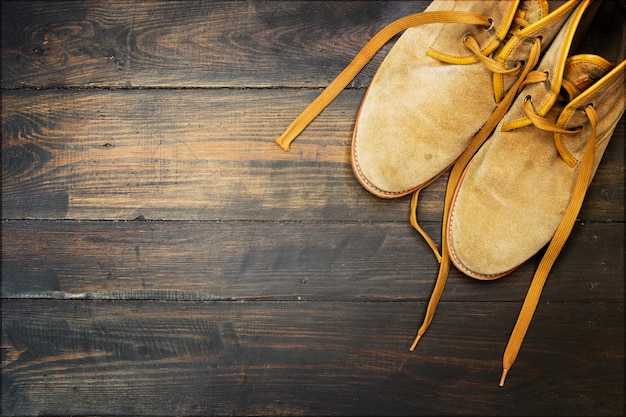 Desert shoes on the wooden background