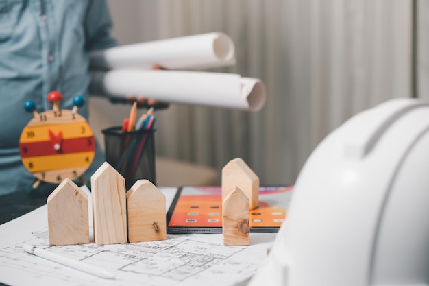 The design concept of a young architect and engineer creates a\
structural model of a wooden house