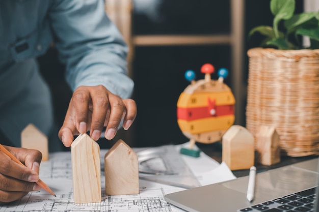 The design concept of a young architect and engineer creates a structural model of a wooden house