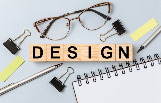 design word on wooden cubes on office desk