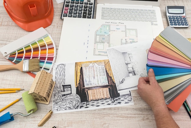the designer chooses the perfect color for a new apartment. sketch of a modern apartment