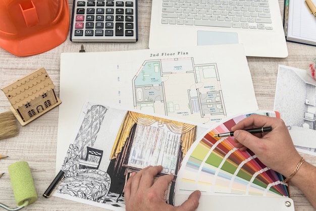 The designer chooses the perfect color for a new apartment. Sketch of a modern apartment