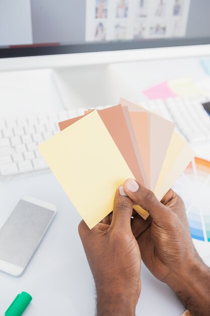designer holding colour swatch and choosing