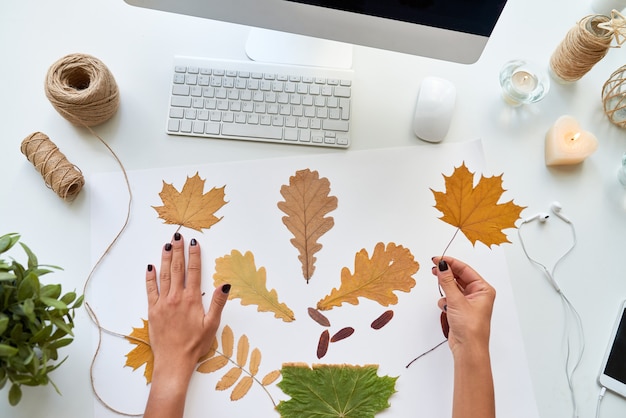 Photo designer making autumn decorations