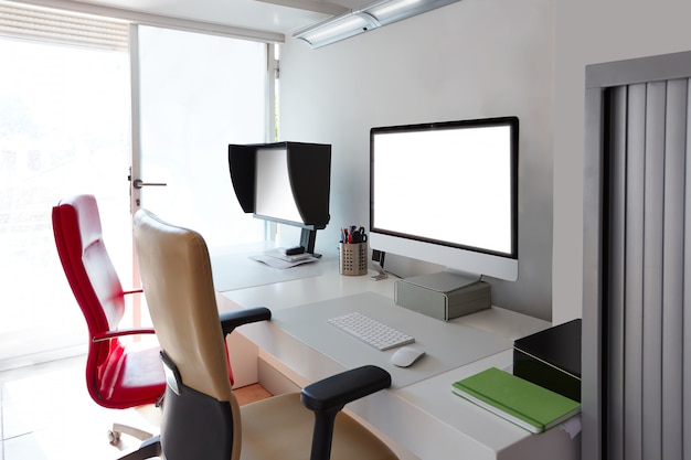 Photo designer office desk with computer screens