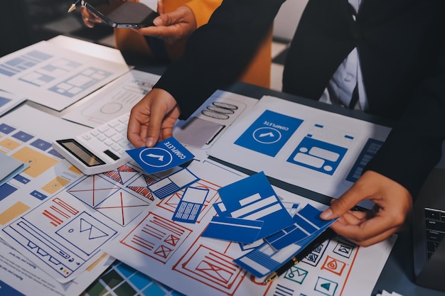 The designer team is designing the uxui system to make the uxui system work well on new phones and support system updates Website development concept UI UX front end designer