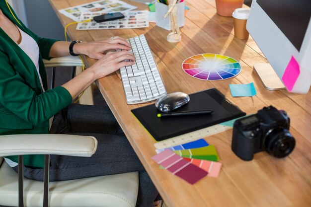 Designer typing on keyboard 