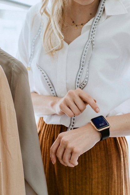 Designer using a digital smartwatch