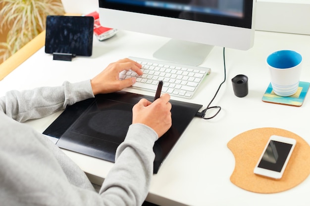 Designer using graphic tablet at office