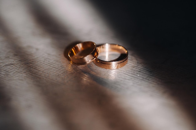 Designer wedding rings lying on the surface Two wedding rings