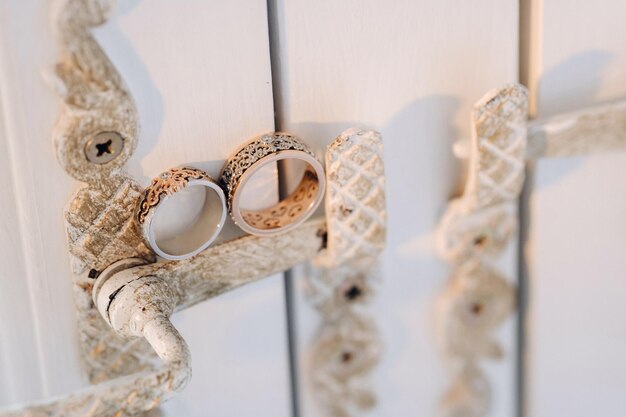 Designer wedding rings lying on the surface Two wedding rings