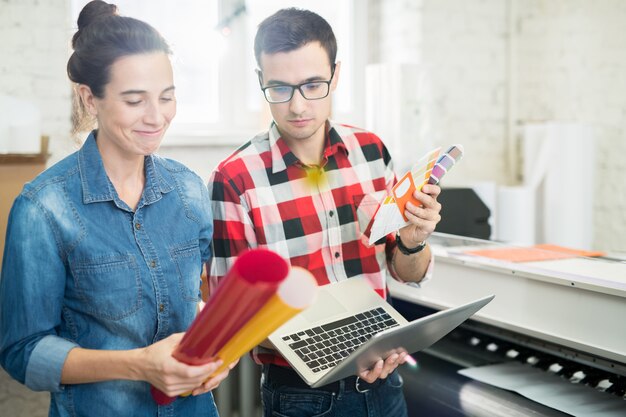 Designers choosing color of printing paper