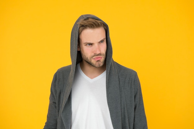 Desirable appearance. Male beauty and masculinity. Guy attractive confident model. Sport style. Active lifestyle. Man handsome well groomed confident macho on yellow background. Feeling confident.