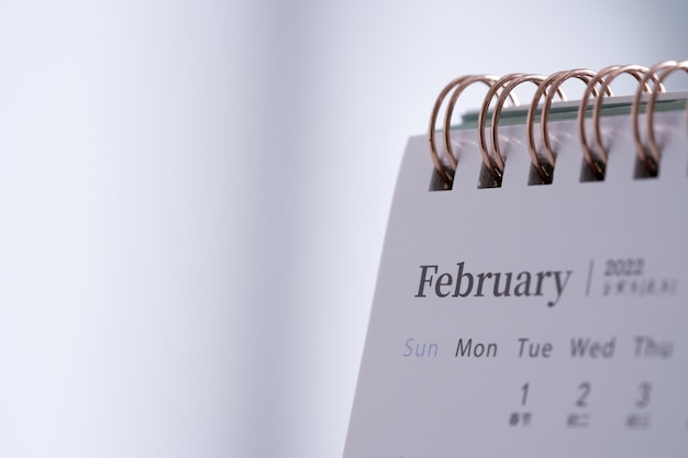 Photo desk 2022 calendar on the table top - february