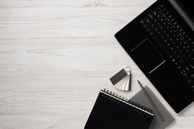 Photo desk arrangement with laptop flat lay