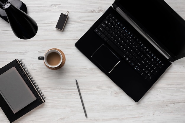 Photo desk arrangement with laptop above view