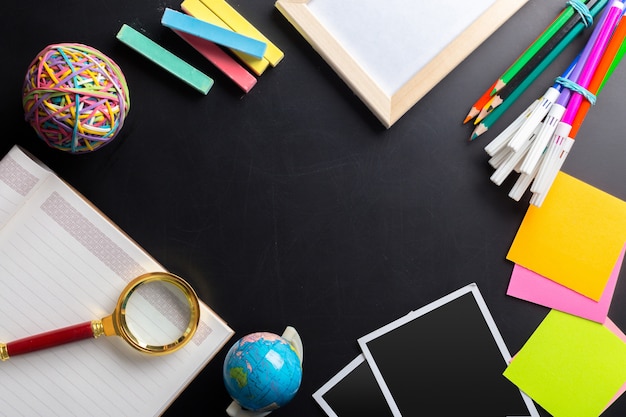 Desk of an artist with lots of stationery objects