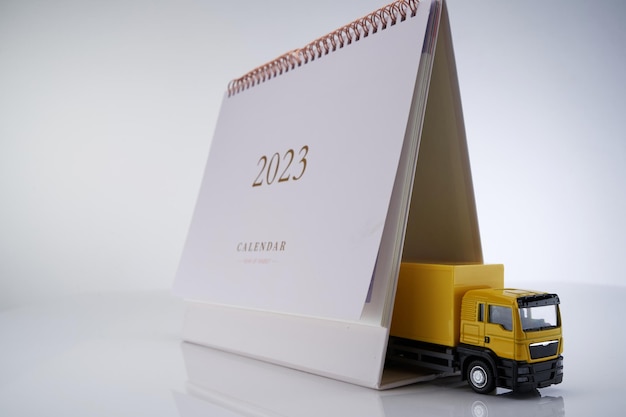 Desk calendar and yellow toy truck