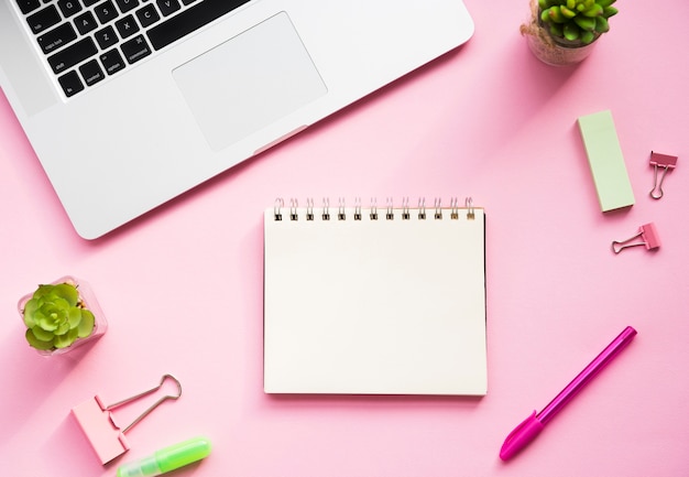 Photo desk design with blank notebook