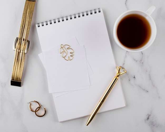 Desk items arrangement on marble table top view