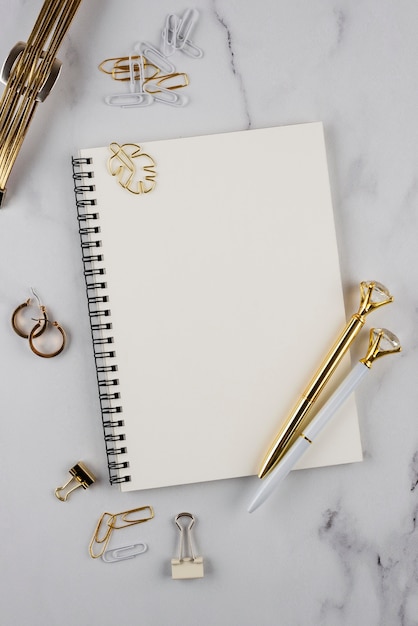 Desk items on marble table flat lay