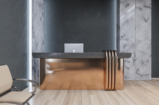 A desk in a lobby with a black wall behind it.